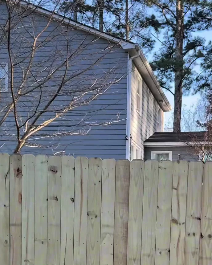 Crew member at a fence replacement
